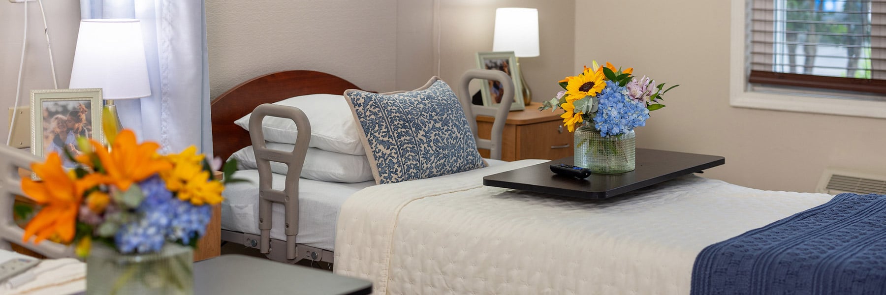 Bedroom with flowers at Southern Oaks Post Acute