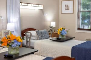 Bedroom with flowers at Southern Oaks Post Acute