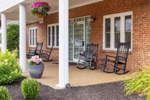 Patio with rocking chairs at Southern Oaks Post Acute